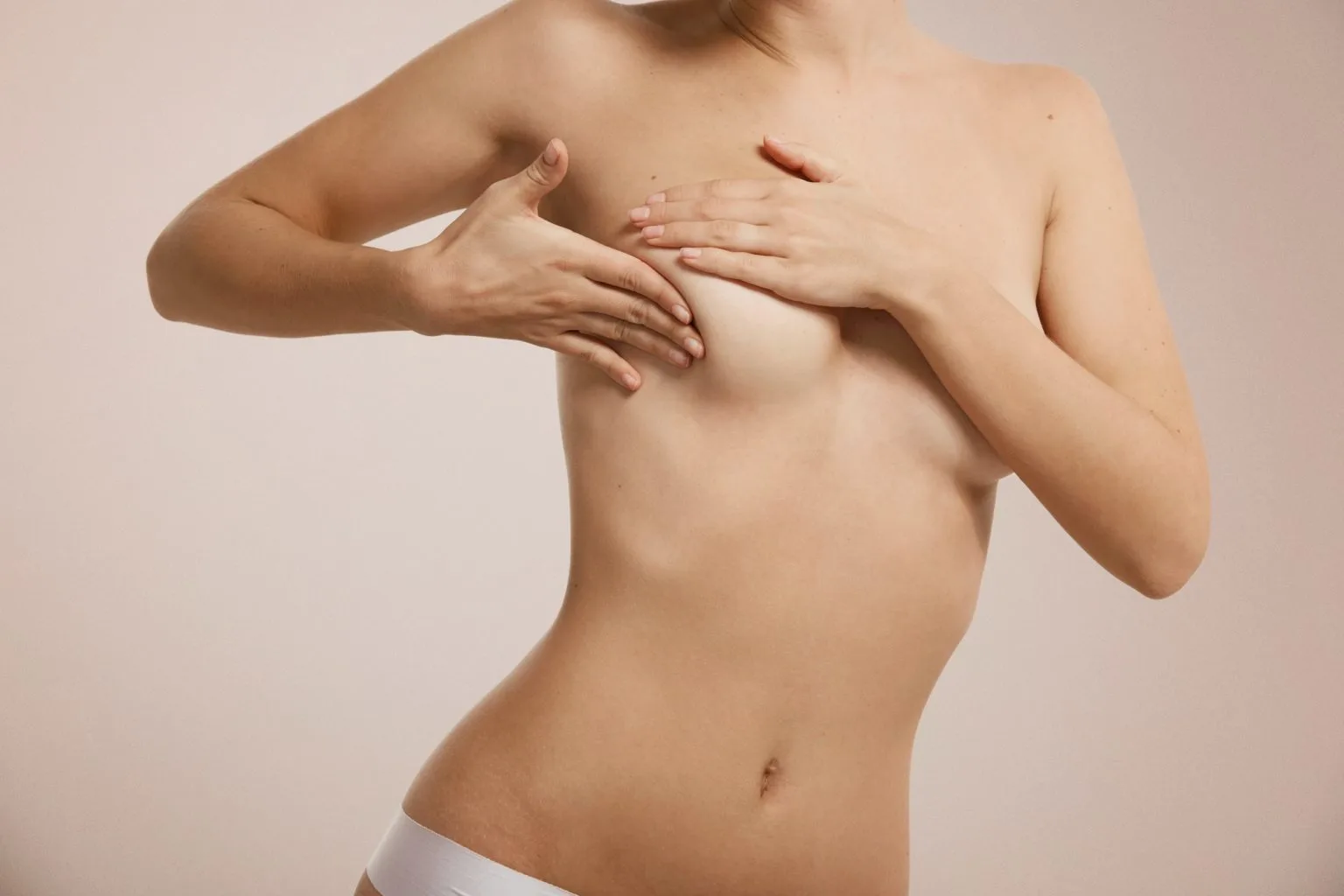 breast-cancer-concept-woman-checking-her-breast-1536x1024
